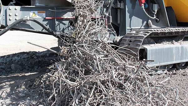 Magnet segregates rebar from crushed concrete aggregate